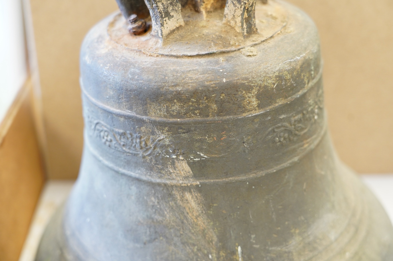 An 18th/19th century bronze bell, initialled TR, 33cm high. Condition - poor to fair, some losses to the rim